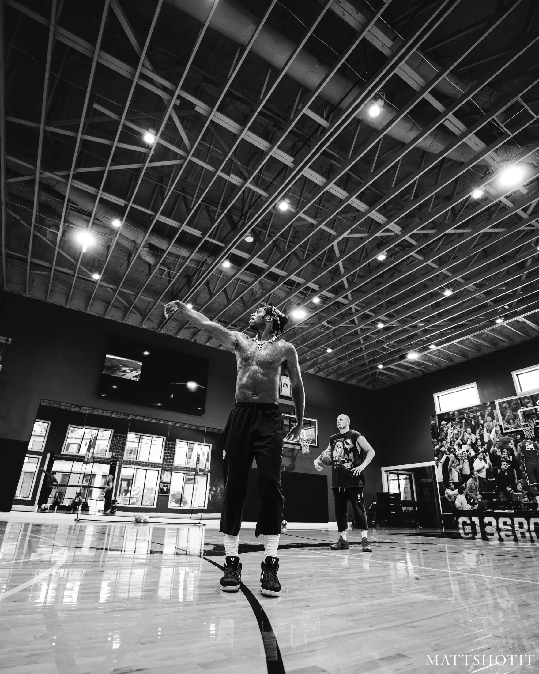 Buddy Hield follows through on a shot while Trey Slate observes. Photograph by MATTSHOTIT.